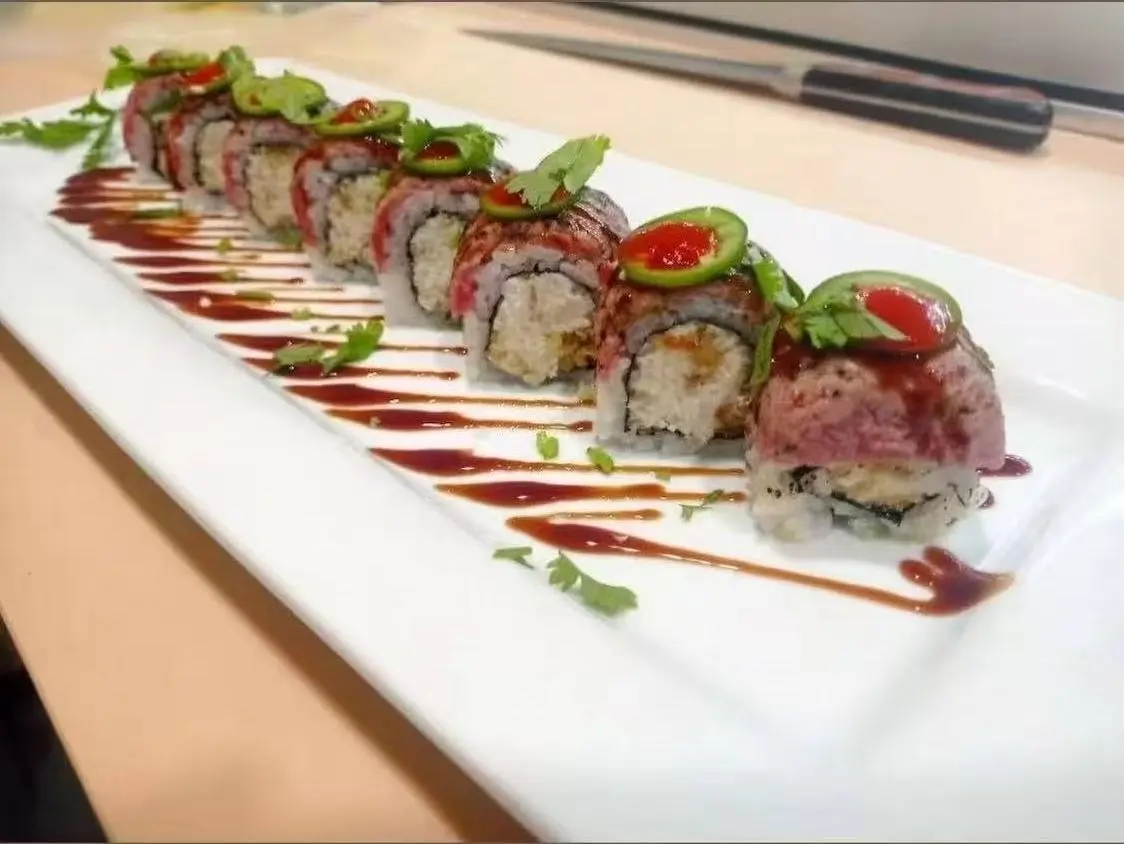 OK-Ramen&Sushi-Bar-Japanese-Restaurant-Grilled-Beef-Sushi-Rolls-Oklahoma-City Grilled Beef Sushi Rolls - Sushi rolls filled with grilled beef, garnished with jalapenos and sauce at OK Ramen & Sushi Bar, a Japanese Restaurant in Oklahoma City